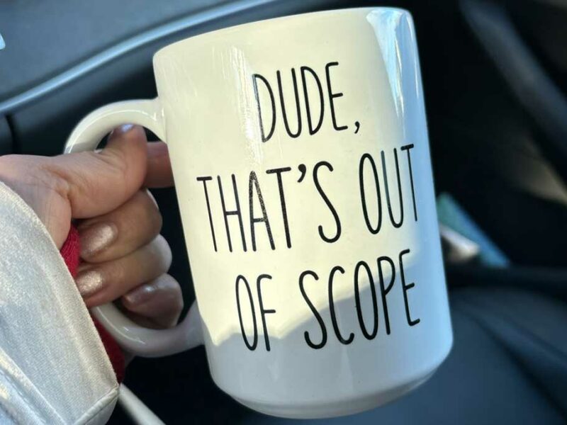 Coffee mug that has the text "Dude, that's out of scope"