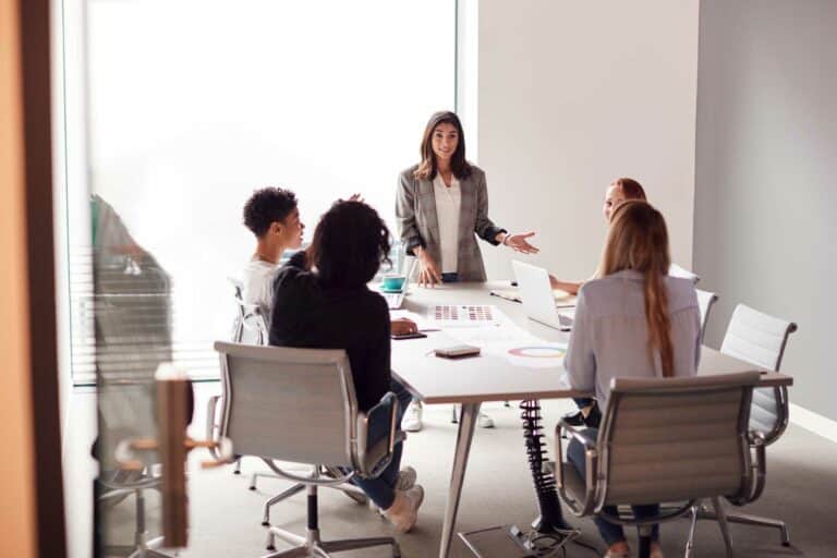 Woman presenting to a small group