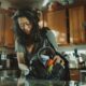 Woman reaching into her cluttered purse