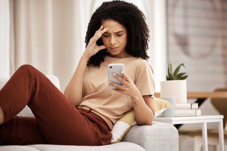 Woman falling into the comparison trap through social media