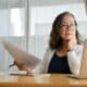 Woman on her computer trying to figure out how to write a business plan