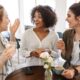 A group of three women using their communication skills to have a conversation