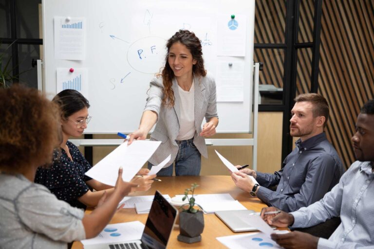 Woman delegating tasks to her team