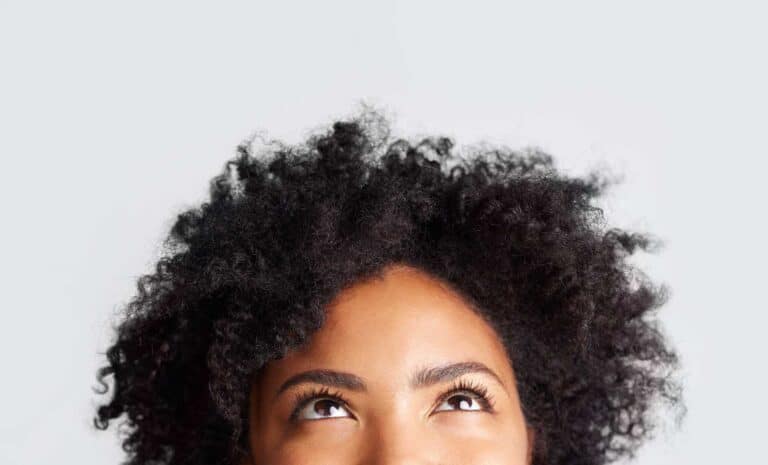 A woman thinking about growth mindset vs. fixed mindset