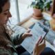 Woman using a planner to work on sustainable productivity